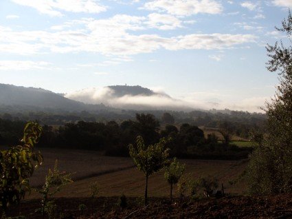 The village emerging from the clouds